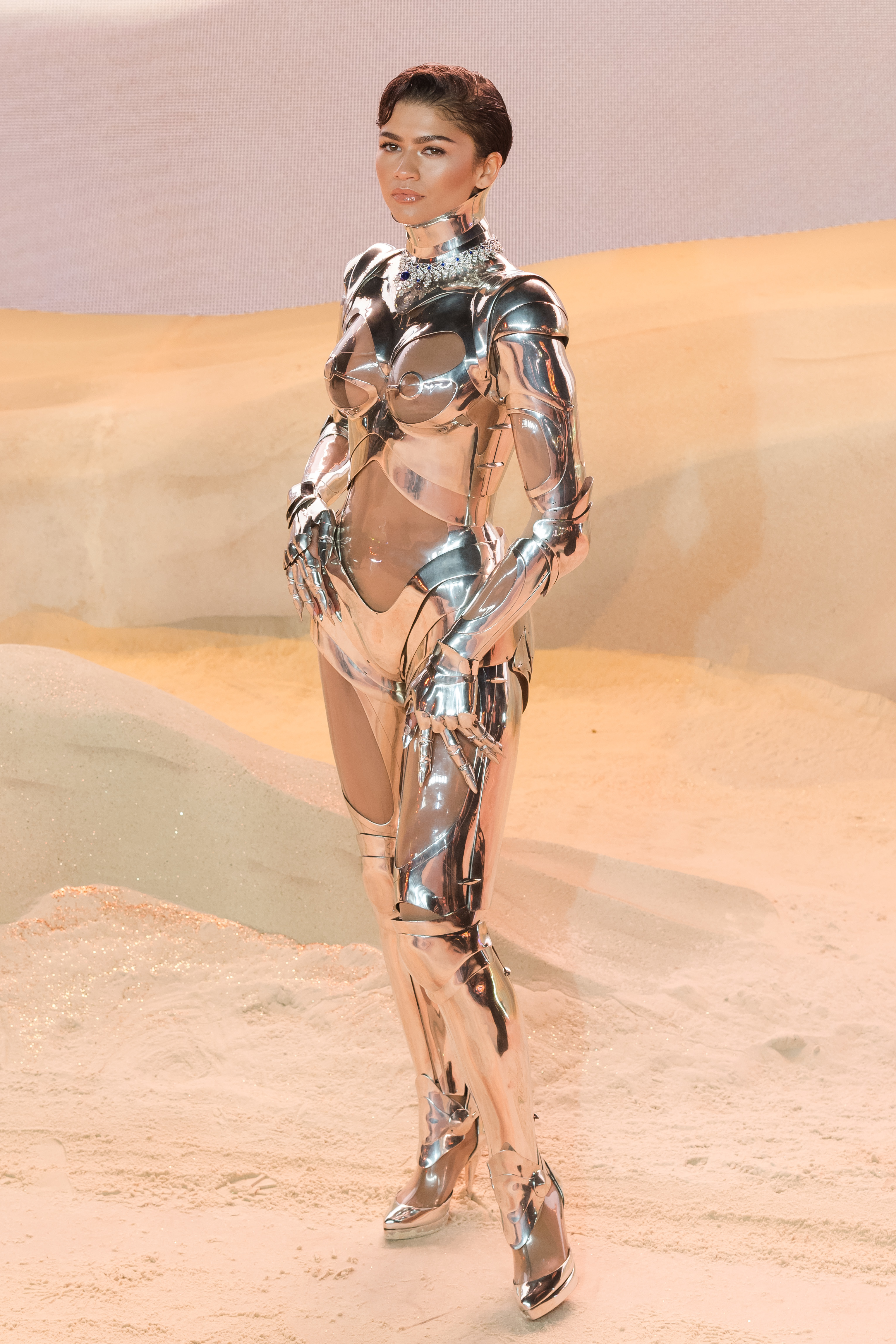 Closeup of Zendaya in a metallic fembot suit by Mugler