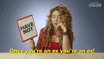 Woman holding a &quot;HAVE NOT&quot; sign, expressing opinions during a game or interview