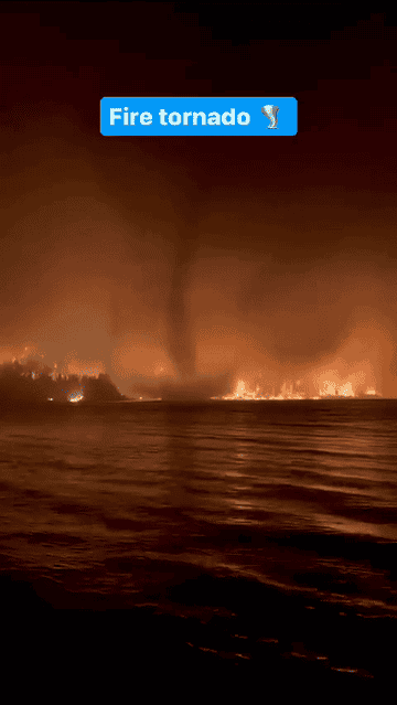 A fiery tornado seen from a water body with text overlay &quot;Fire tornado&quot;