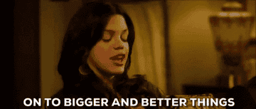 Woman speaking, text overlay reads &quot;ON TO BIGGER AND BETTER THINGS&quot;