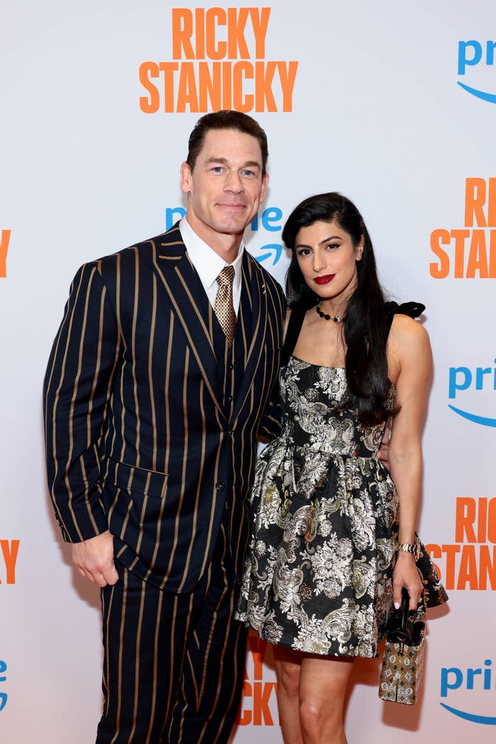 Closeup of John Cena and Shay Shariatzadeh on the red carpet