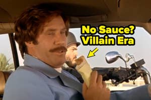 Character Ron Burgundy in a car, eating a burrito, with a biker visible outside the car window