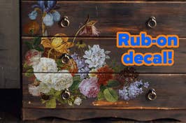 Floral decals on a wooden chest of drawers with text "Rub-on decal!" indicating a DIY decoration option