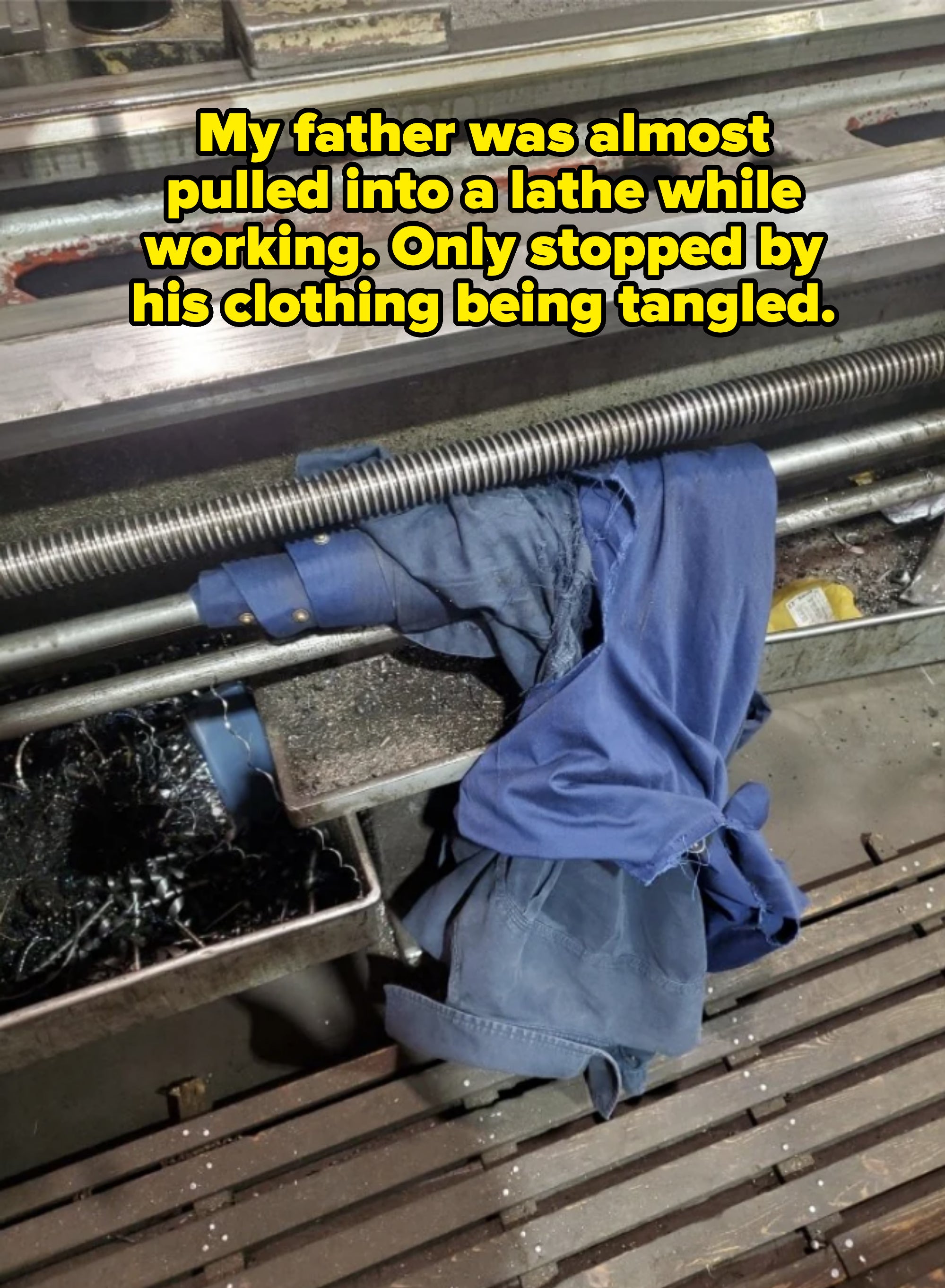 Discarded blue clothing on a bench with metal rods and debris