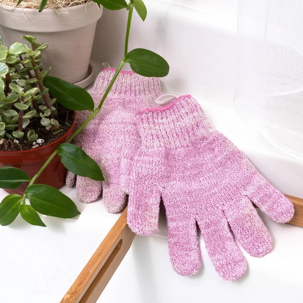 Pair of pink knit exfoliating gloves