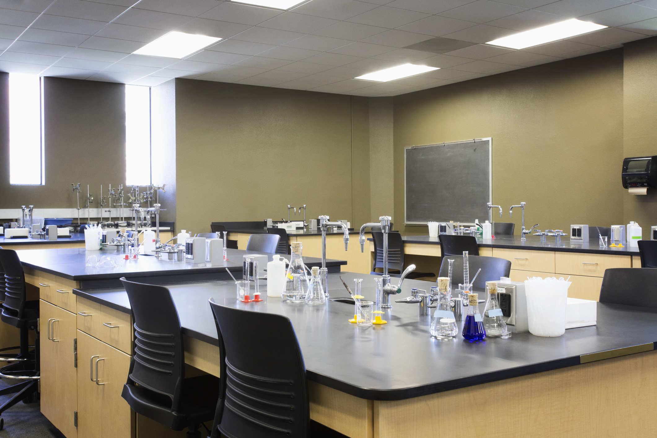 Science laboratory with beakers and test tubes on benches, no individuals present
