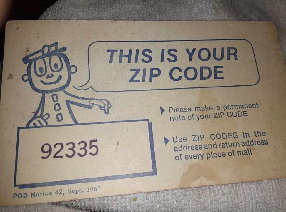 Illustration of a cartoon character next to &quot;This is your ZIP CODE&quot; with a sample code &quot;92335&quot; on a postal notification card