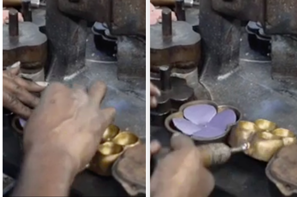 Hands shaping metal with a machine, crafting intricate objects