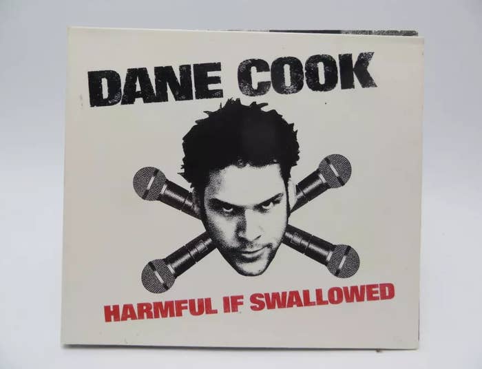 Album cover of Dane Cook &#x27;Harmful If Swallowed&#x27; with his face centered and microphones crossed below