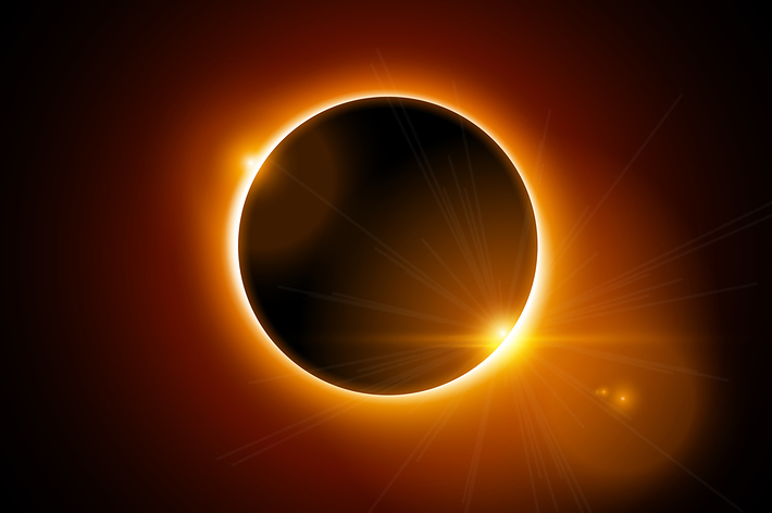Solar eclipse with bright corona visible and starburst effect to one side