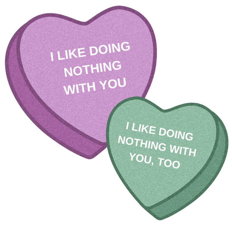 Two heart-shaped candies with phrases &quot;I LIKE DOING NOTHING WITH YOU&quot; and &quot;NOTHING DOING WITH YOU, TOO&quot;