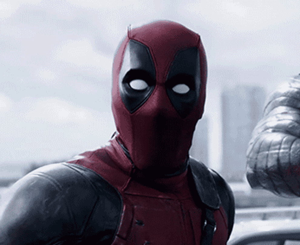 Deadpool in costume with a raised eyebrow expression