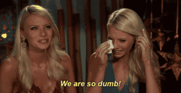 Two women wiping tears and laughing with caption &quot;We are so dumb!&quot;