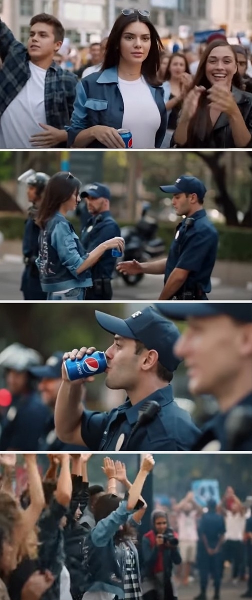 Kendall Jenner gives a Pepsi can to a police officer in a crowd during an ad, symbolizing unity