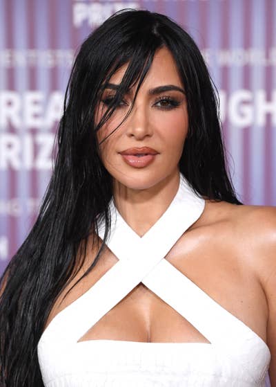 Close-up of Kim Kardashian wearing a white crisscross halter top