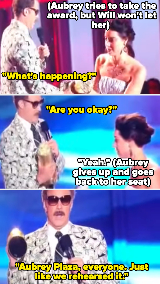 Aubrey Plaza and Will Ferrell act humorously on stage, with Plaza initially attempting to take an award and eventually sitting down as part of a rehearsed skit