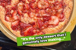 Freshly baked strawberry cake on a baking sheet with a quote about dessert