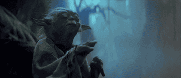 Yoda holds a cane and uses the Force
