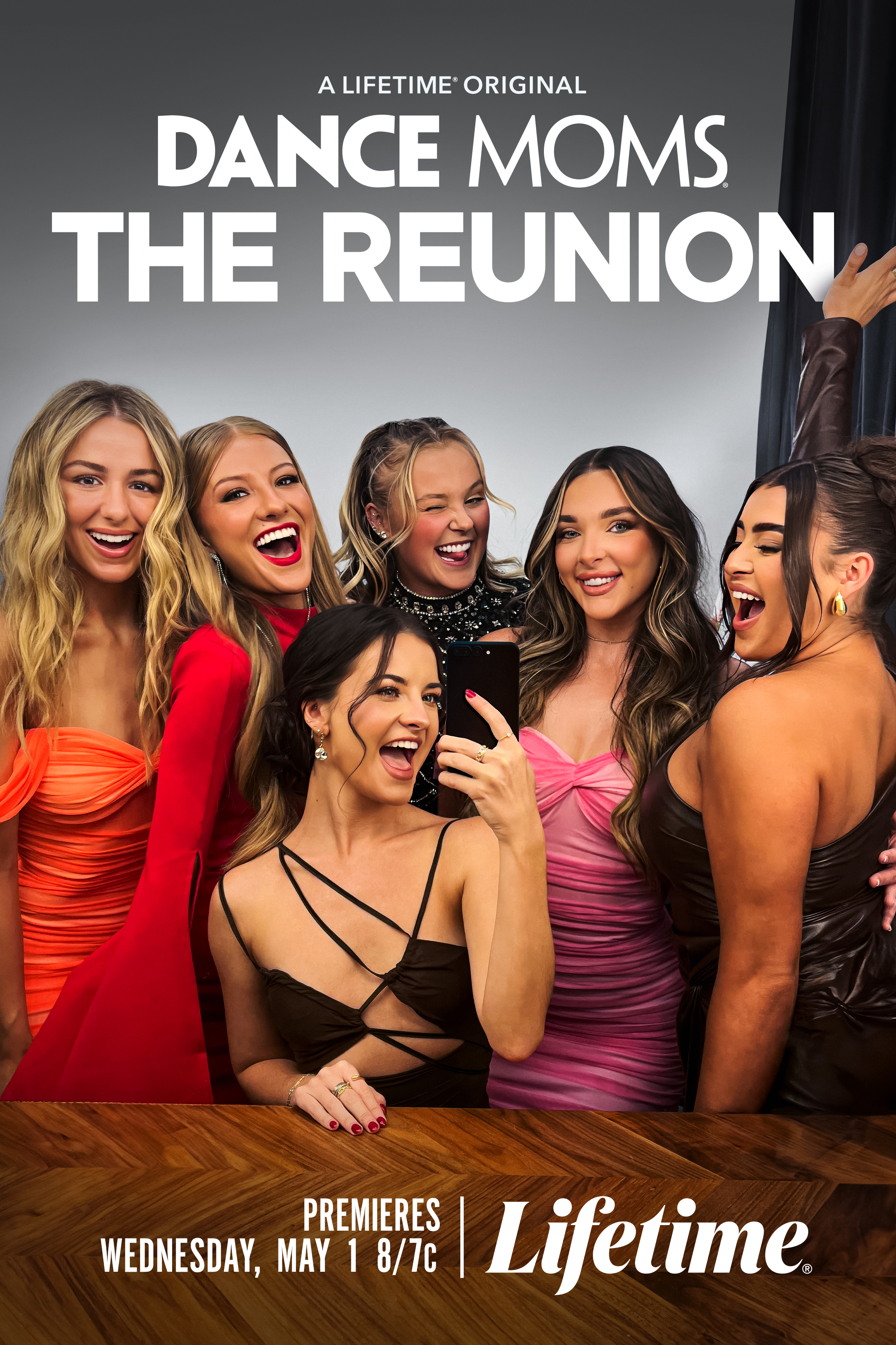 Reunion poster of &#x27;Dance Moms&#x27; cast with six women smiling, posing for a selfie, dressed in elegant evening wear