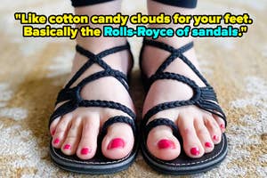 Close-up of a person's feet in black braided sandals, with quote "like cotton candy clouds for your feet. Basically the Rolls-Royce of sandals"