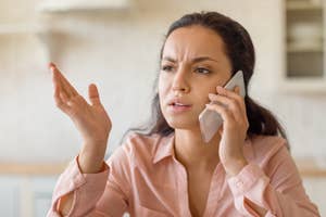 Woman on the phone looking frustrated or confused