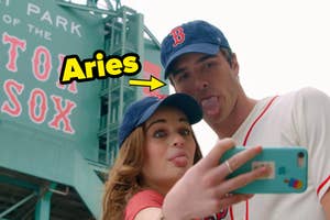 Noah and Elle from "The Kissing Booth" sticking their tongues out in baseball hats with an arrow pointing to Noah that says "Aries."