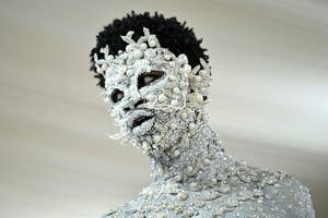 Lil Nas X with a jewel covered face at the Met Gala