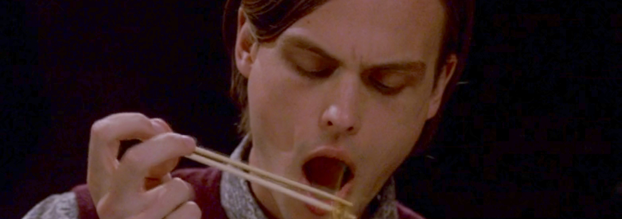 Matthew Gray Gubler attempting to eat with chopsticks as Spencer Reid on Criminal Minds