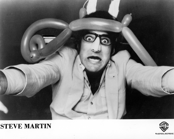 Steve Martin with balloon hat in a promotional black and white photo