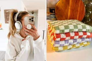 Person with headphones taking a selfie and a stack of checkered kitchen towels