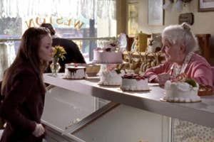 Rory Gilmore from "Gilmore Girls" looks at different cake options.