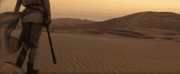 Rey walks the desert with BB-8