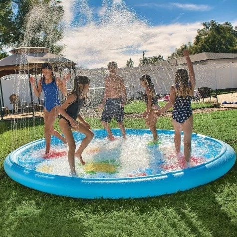 Group of people enjoying a splash in a backyard inflatable pool on a sunny day