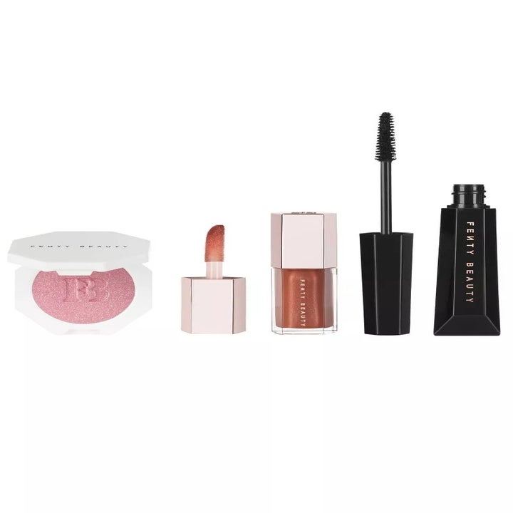 Fenty Beauty makeup products including compact, lip gloss, and mascara