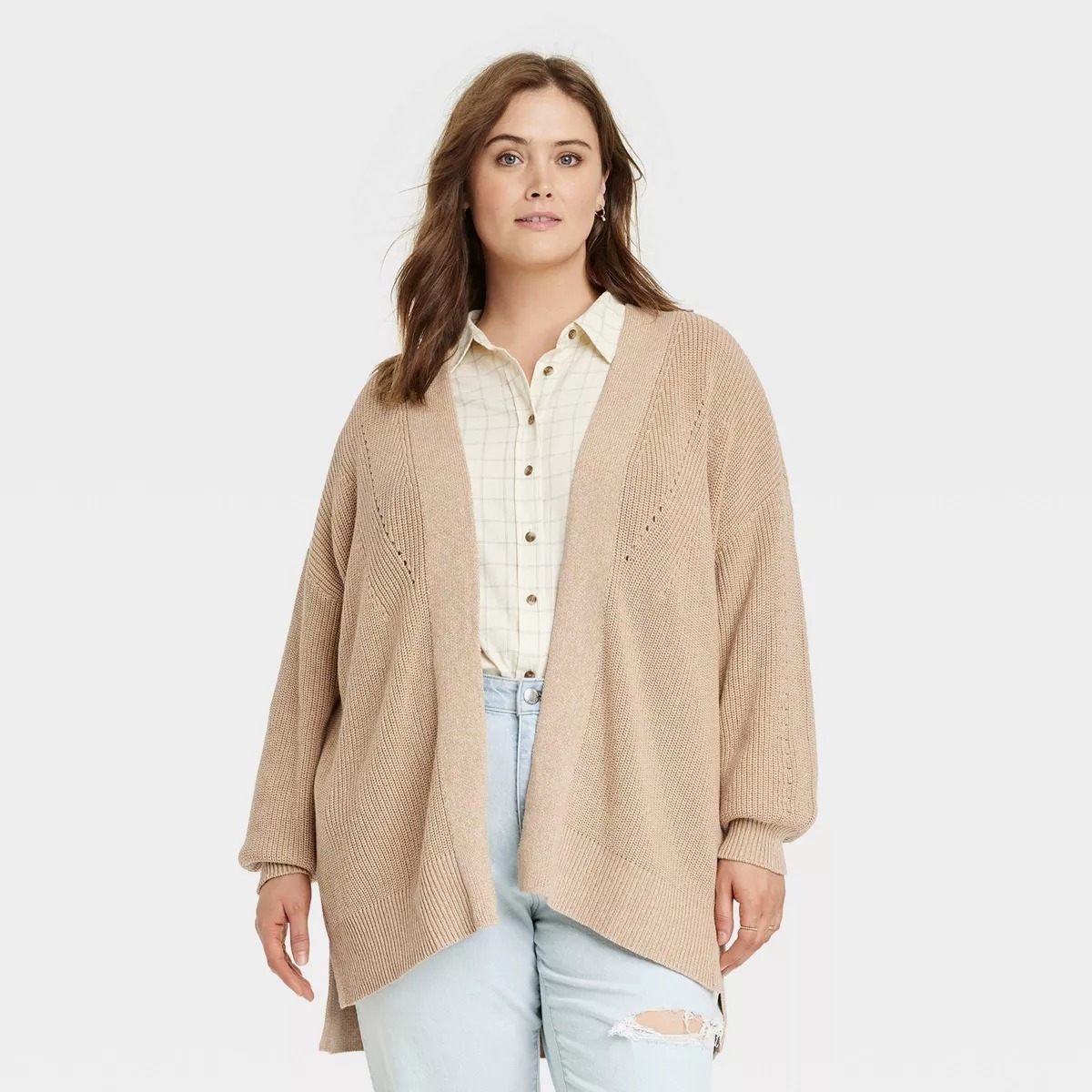 a model in the beige oversized open front cardigan