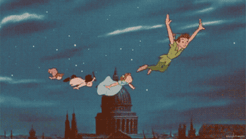 Peter Pan leading Wendy and her brothers in flight over London