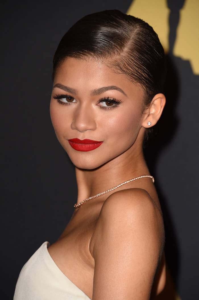 Close-up of Zendaya in a white top with a sleek hairstyle at an event
