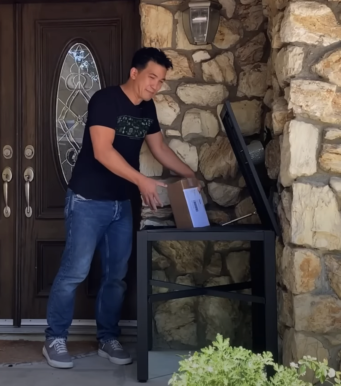 Jason puts a package inside the table hatch