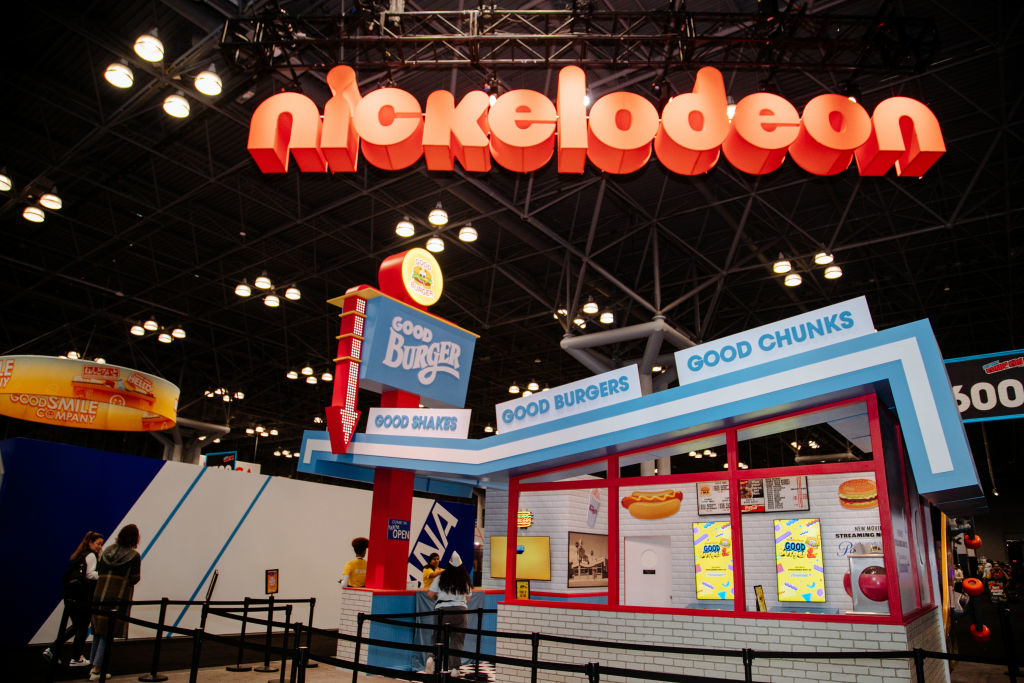 Nickelodeon booth styled as a restaurant from &#x27;Good Burger&#x27; with menus and themed decor at an event