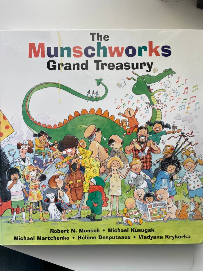 Book cover with various illustrated characters and title &quot;The Munschworks Grand Treasury&quot; by Robert Munsch and illustrators