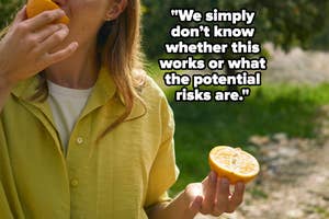 Woman eating orange outside, casual wear, promoting healthy eating for wellbeing