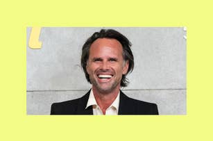 Smiling Walton Goggins in suit without a tie