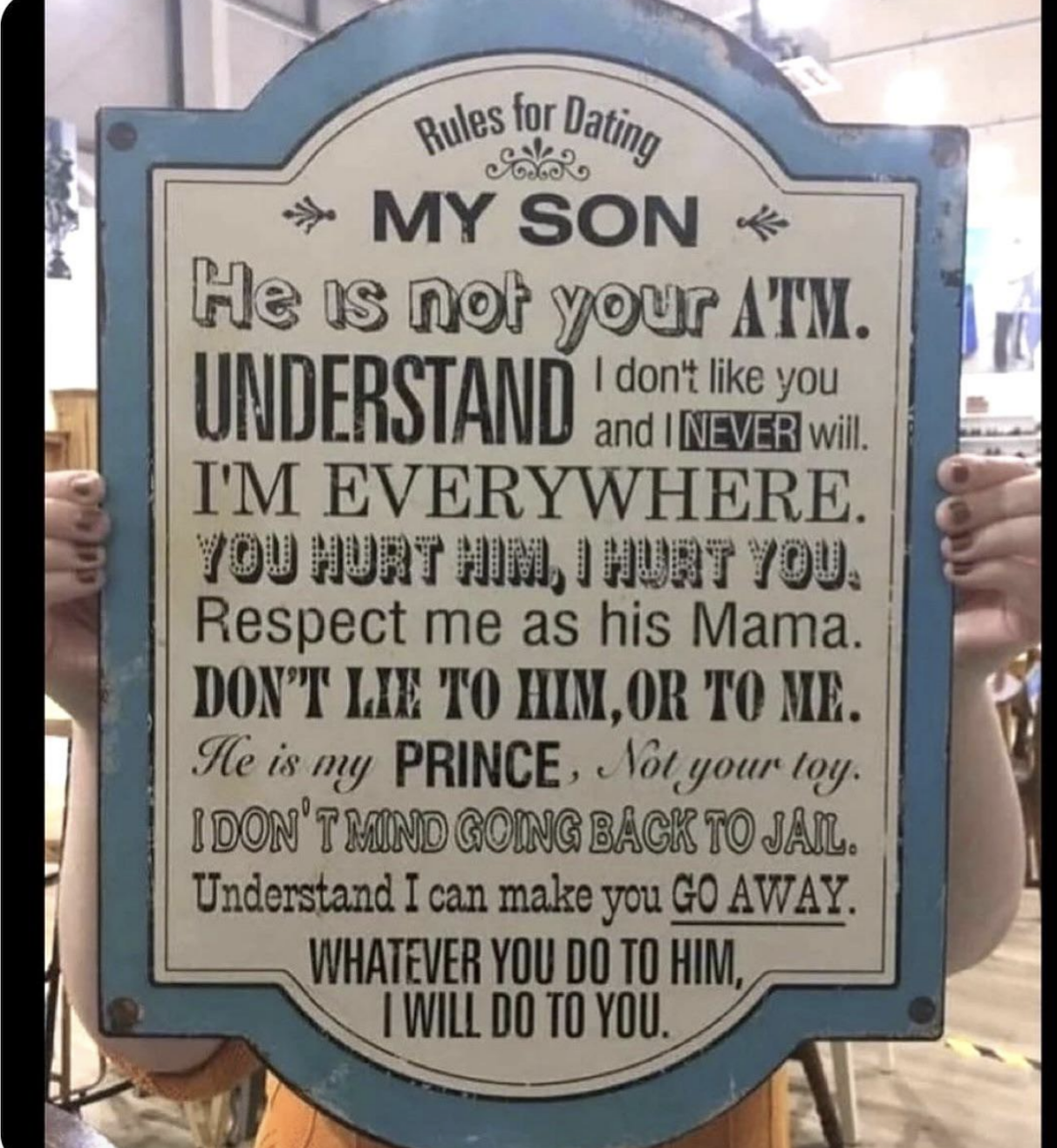 Sign with humorous "Rules for Dating My Son" including protective and exaggerated statements from a parent's perspective