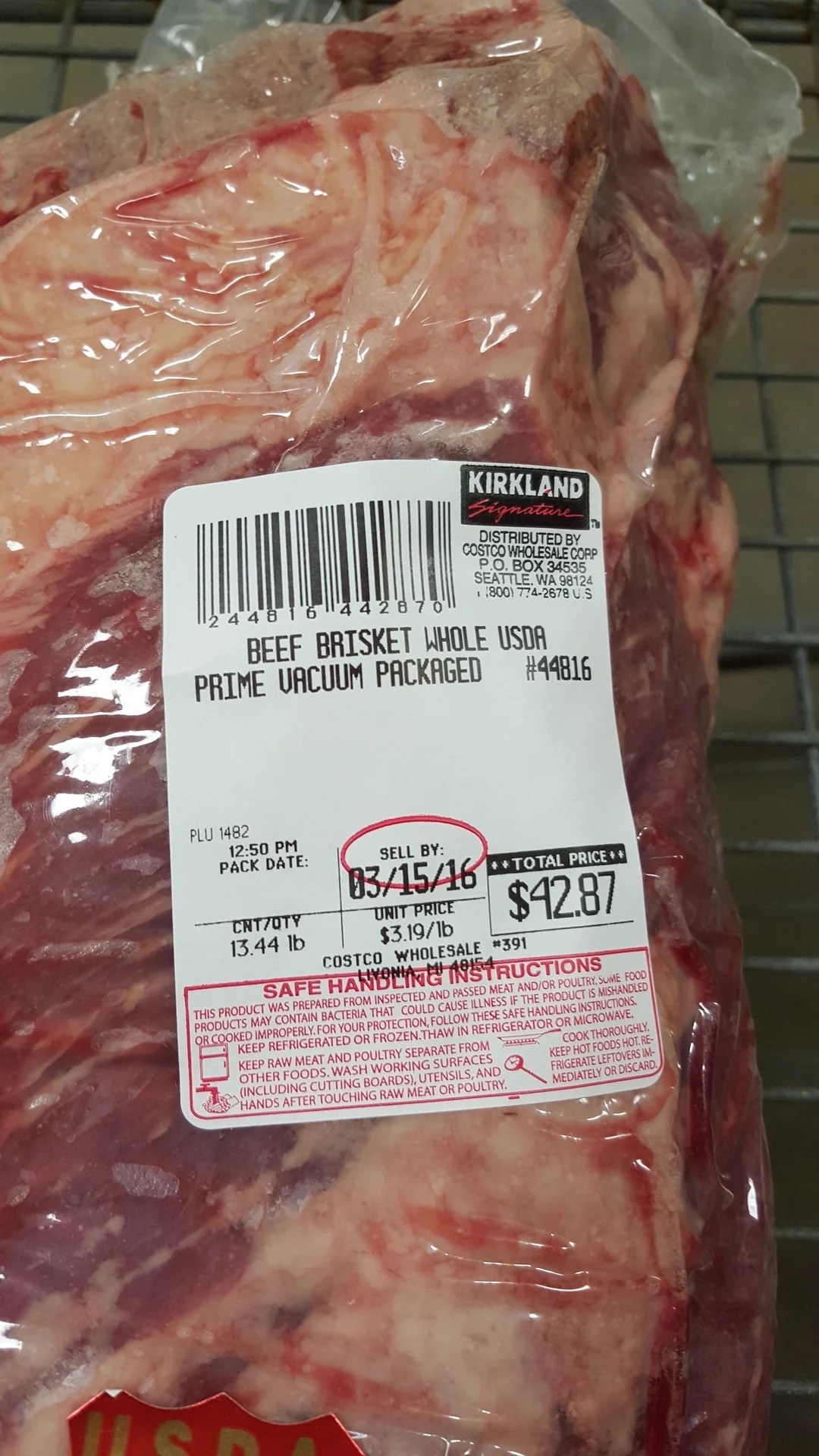 Packaged Kirkland beef brisket with price and sell-by date label, indicating it&#x27;s USDA choice