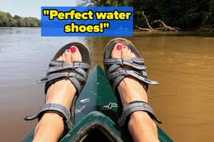 reviewer wearing teva sandals on kayak in water