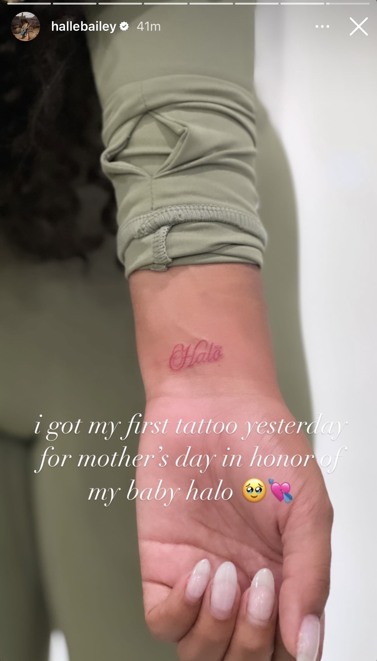 Person shows wrist with tattoo reading &quot;Halo,&quot; caption mentions first tattoo for Mother&#x27;s Day
