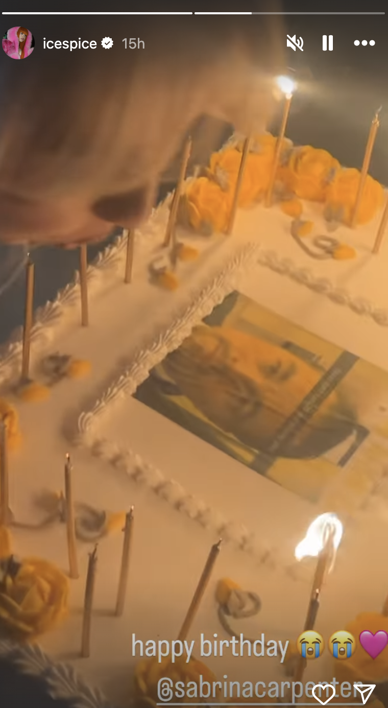 A birthday cake with photo decorations, candles being lit, and a text overlay &quot;happy birthday.&quot;