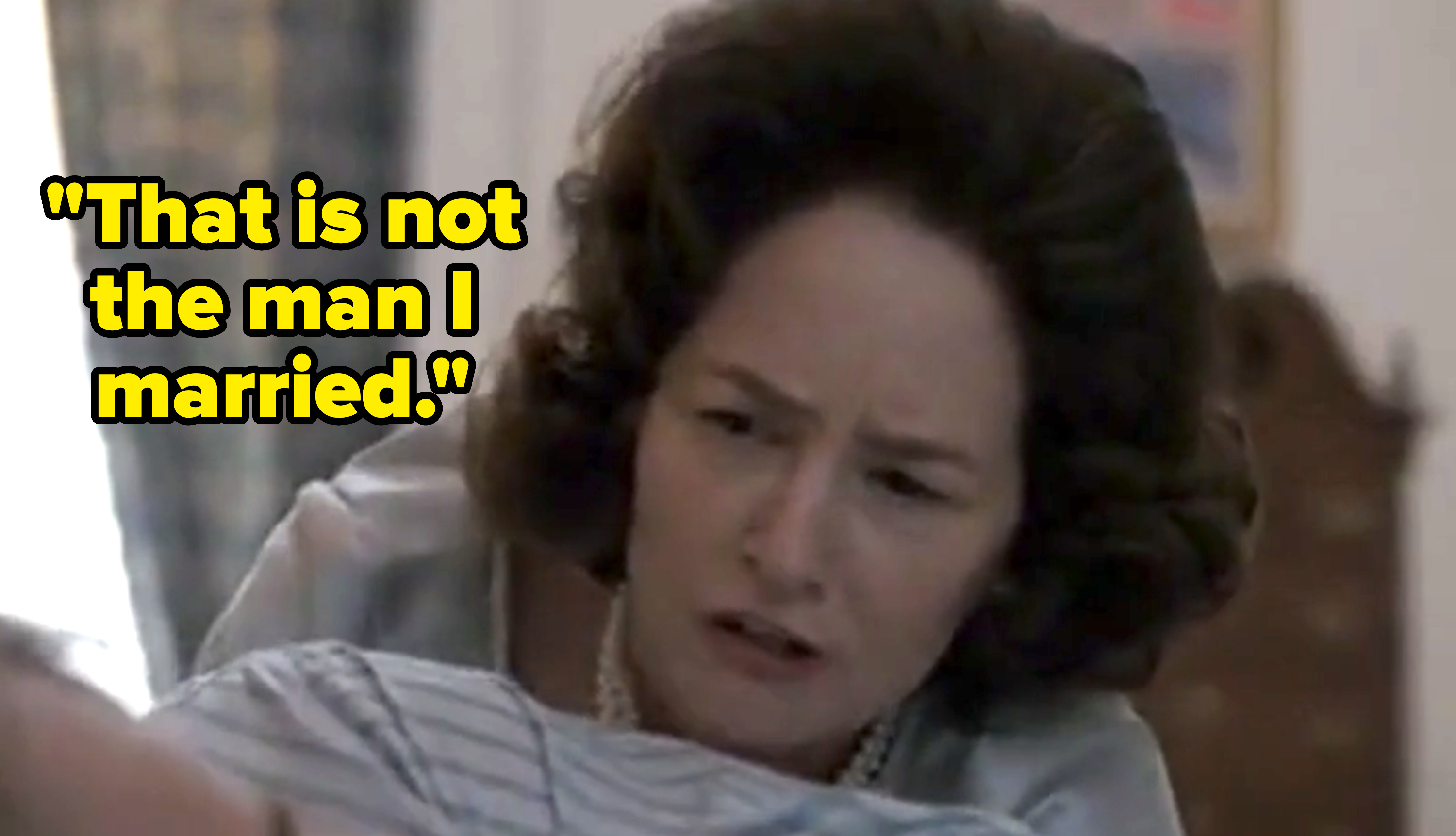 Woman in vintage-style clothing looks distressed, reaching out in a scene from a film or TV show