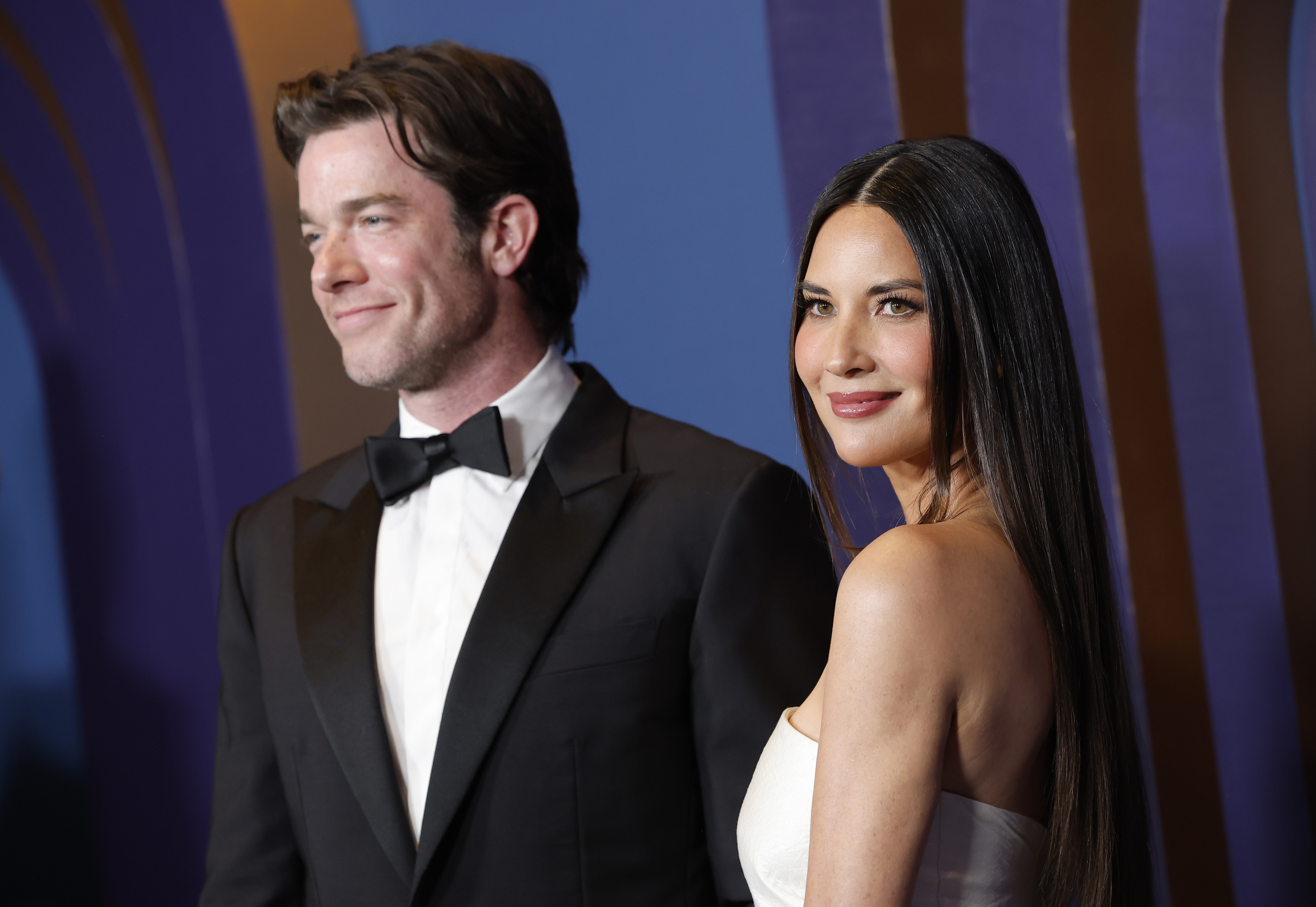 Closeup of John Mulaney and Olivia Munn