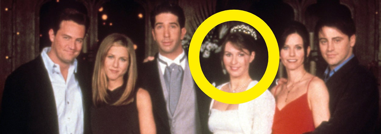 Cast of Friends TV show dressed for a formal event, with one character in a white wedding dress and tiara